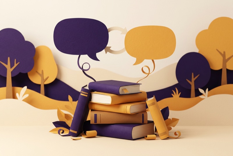Papercraft-Illustration: Bücherstapel mit zwei Sprechblasen für zwei Sprachen